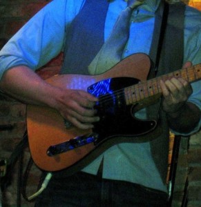 guitarist playing the blues shuffle